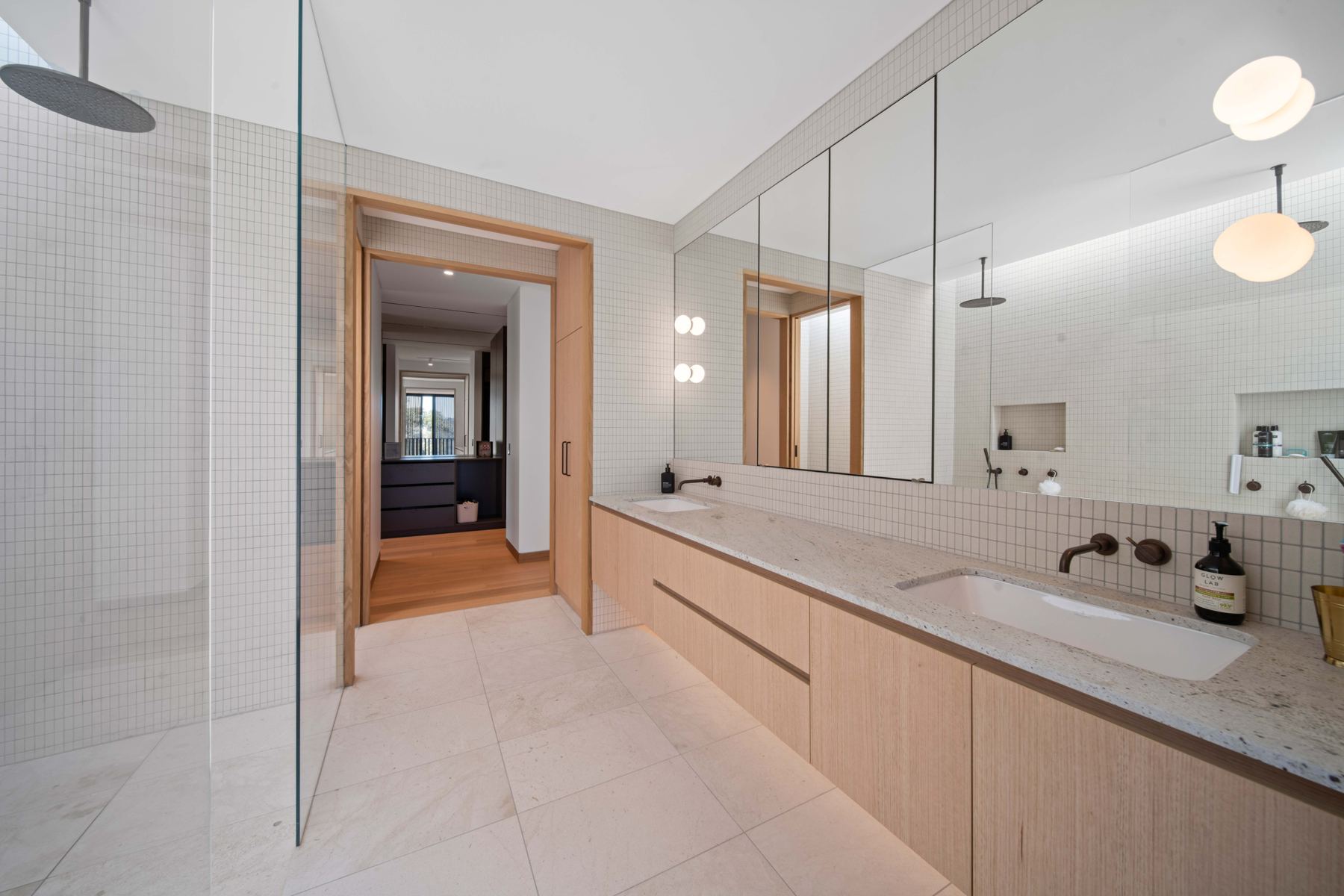 Ensuite with mirror and vanity lighting