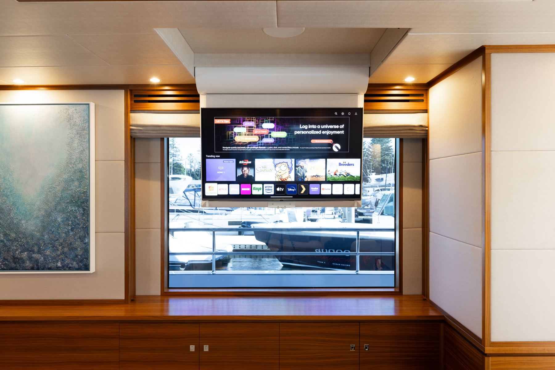 Drop-down TV over a saloon window