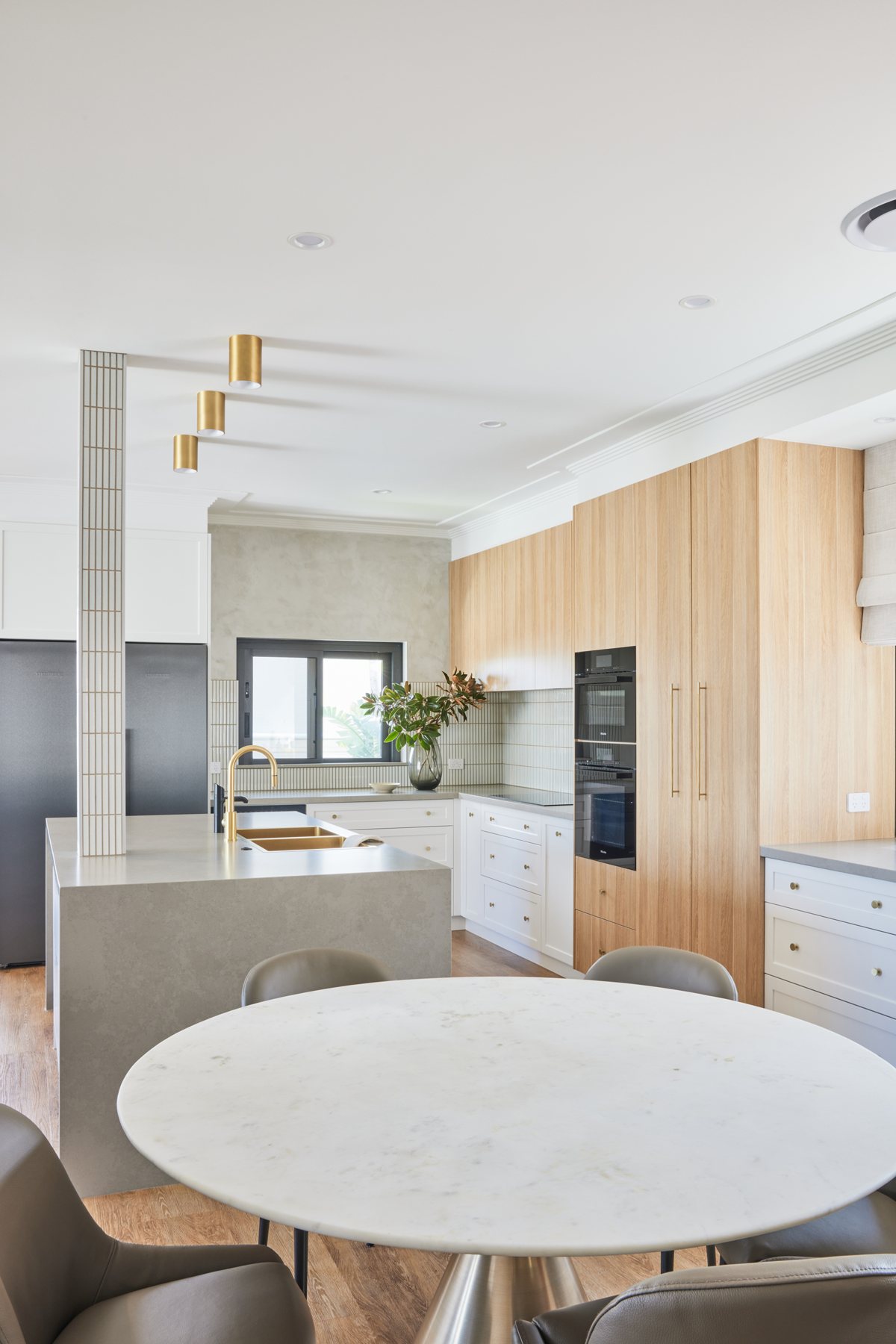 Kitchen with brass surface-mounted downlights over the island