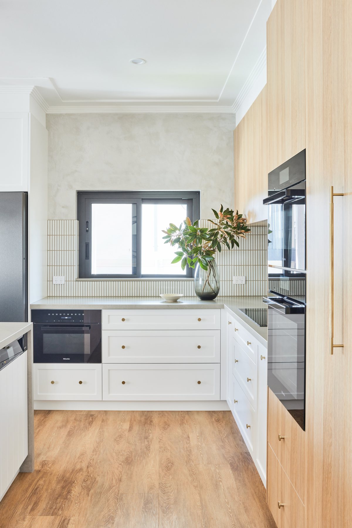 Kitchen corner with integrated Miele ovens and power to the splashback