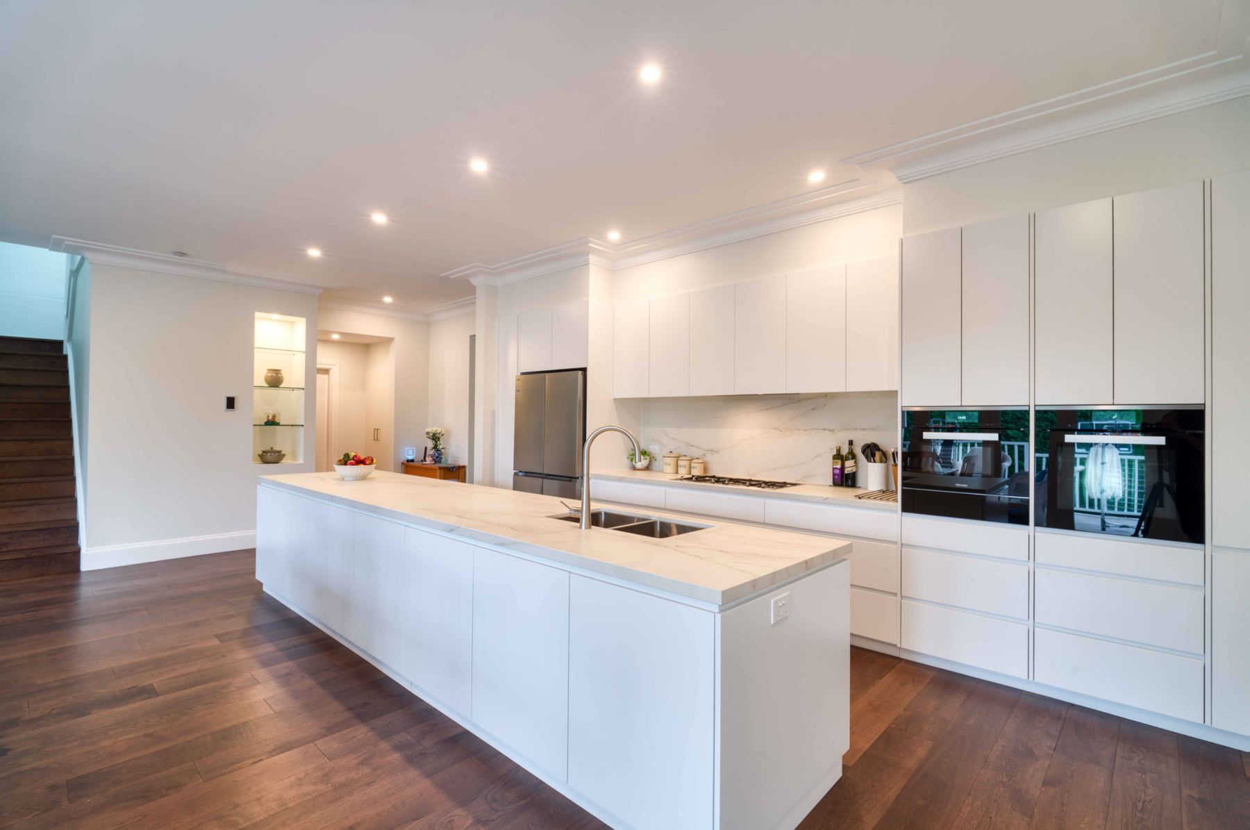 Kitchen with downlights and lit display niche