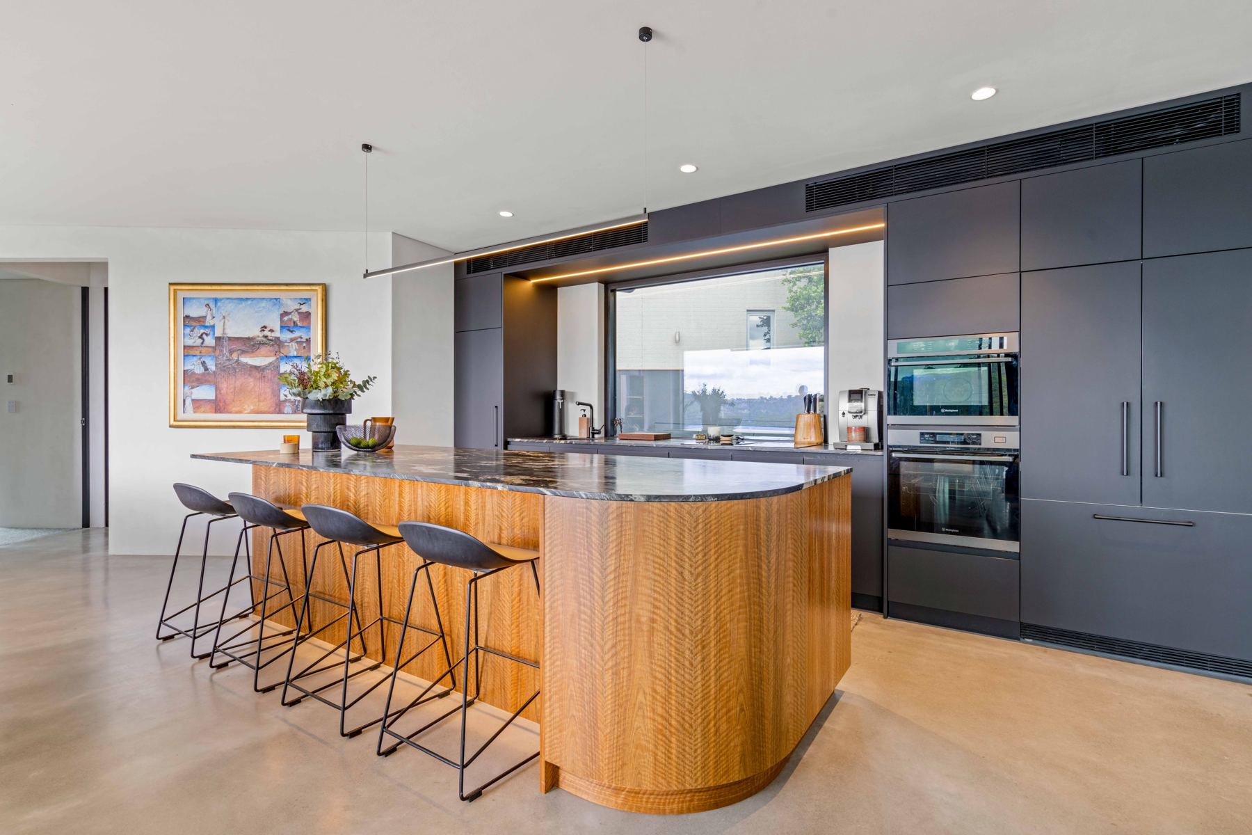 Kitchen with linear pendant and LED strip