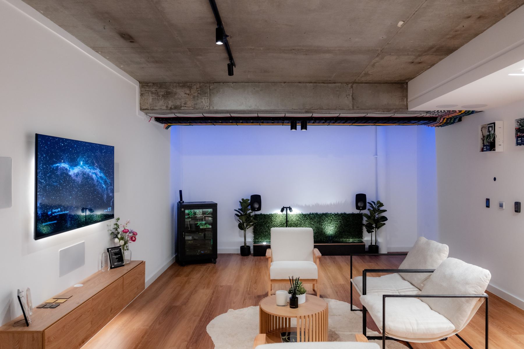 The BSES showroom lounge with media wall, rack and lighting