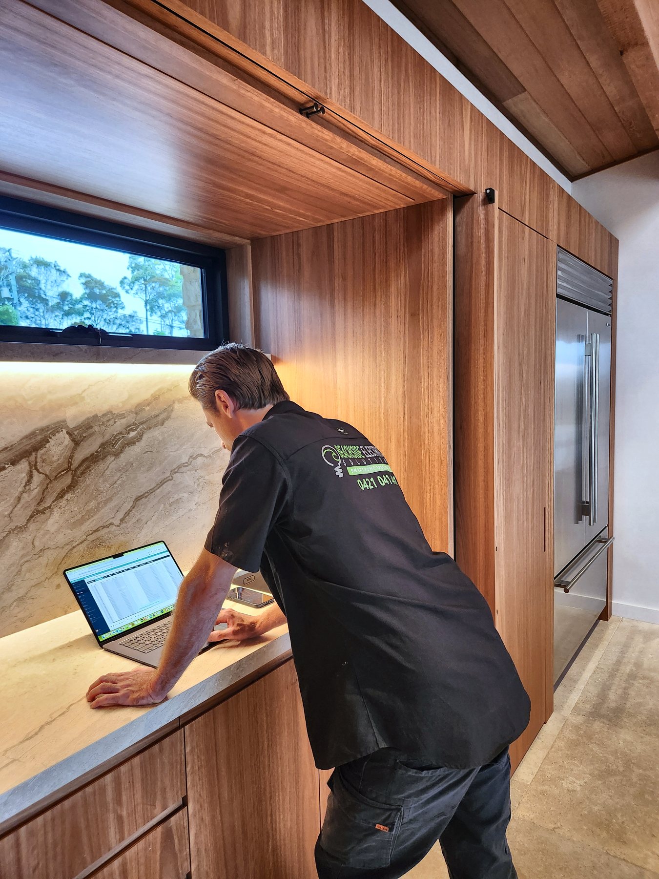 BSES technician commissioning the zencontrol lighting system on a laptop