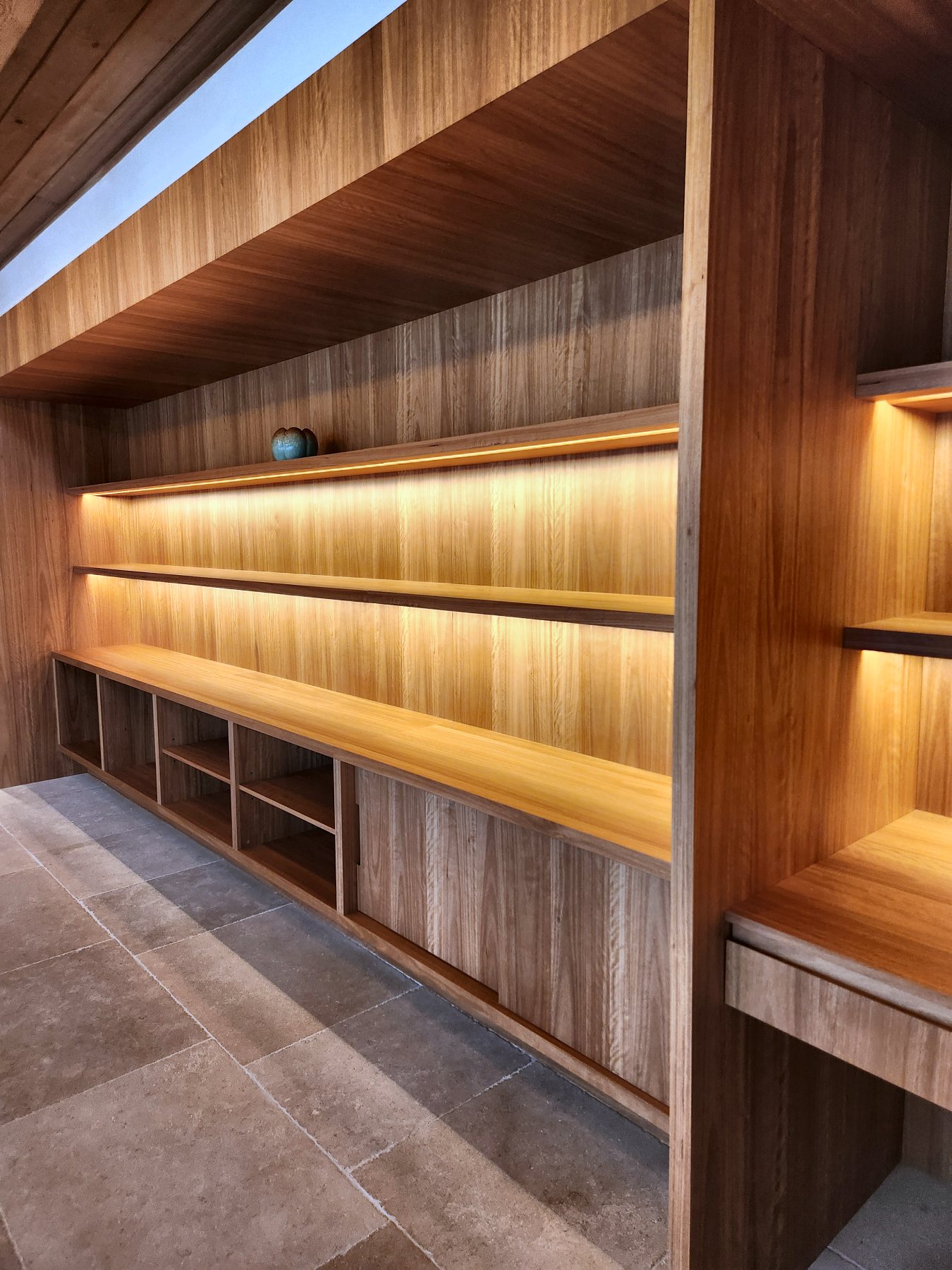 Built-in joinery with LED under every shelf