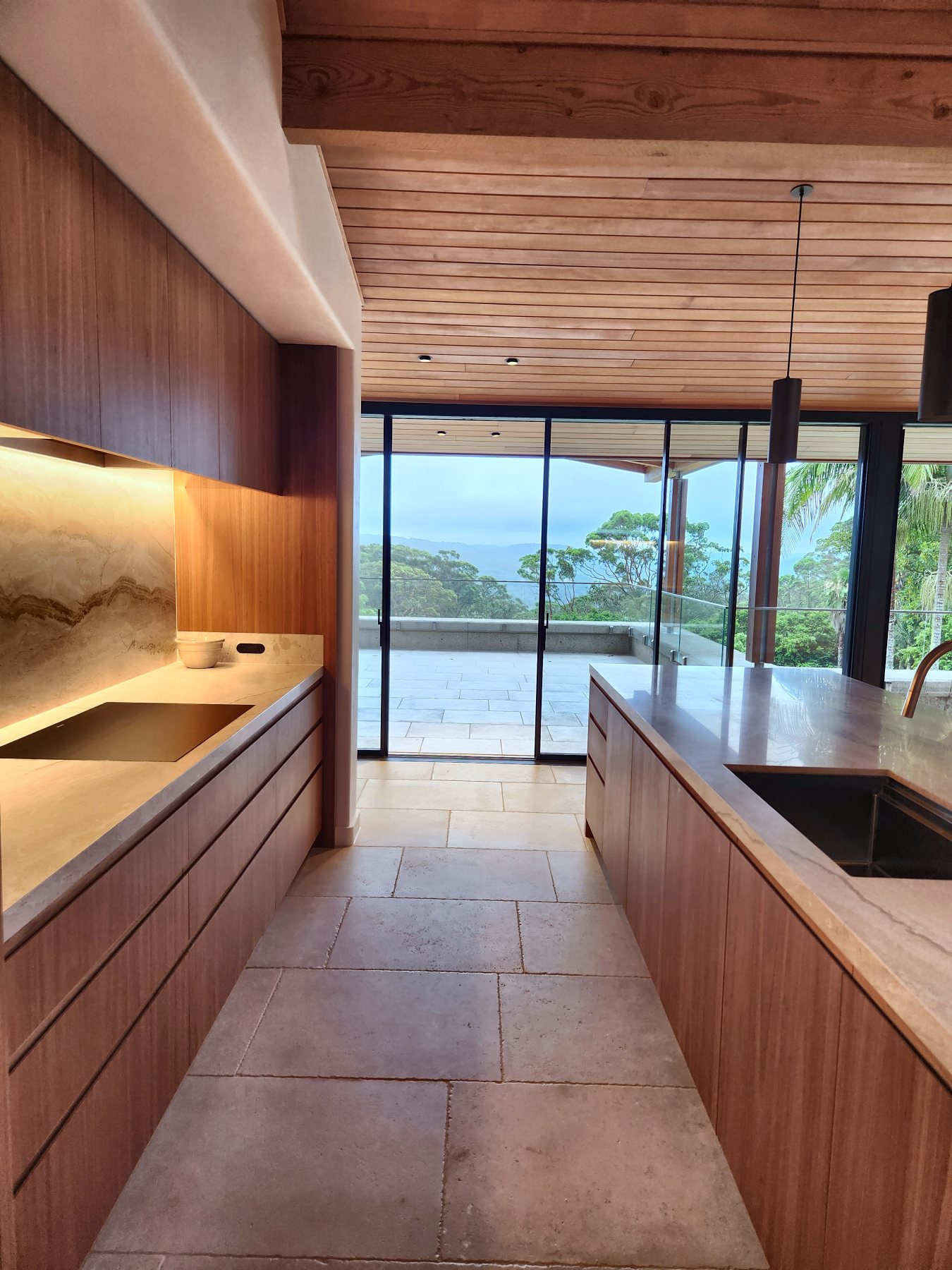 Galley kitchen in timber with LED under the wall cabinets